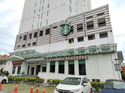 a building with a clock on the front of it at Cozy 1Bedroom- 26th- Gurney - Mansion One in George Town