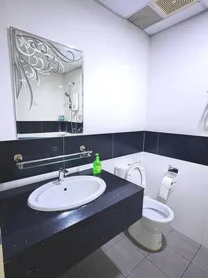 a bathroom with a sink and a toilet at Cozy 1Bedroom- 26th- Gurney - Mansion One in George Town