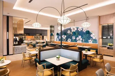 a rendering of a restaurant with tables and chairs at Iconic Regency Service Residences, managed by Iconic Hotel in Bayan Lepas