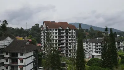 a group of apartment buildings in a city at Big Mama's House in Tanah Rata