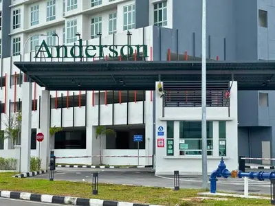 a building with a sign on top of it at Anderson Heritage Suites - Ipoh in Ipoh