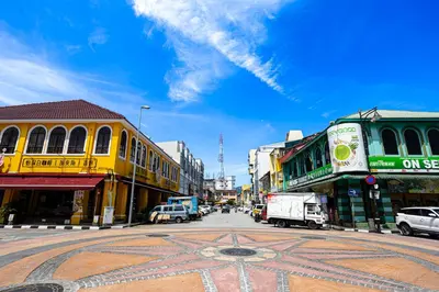 a busy city street with cars on the road at De Quinton Hotel in Ipoh