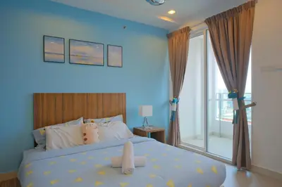 a blue bedroom with a bed with teddy bears on it at Mansion One l 4pax Studio l MountainView & CityView l Gleneagles l by PerfectSweetHome in George Town