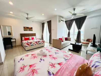 a bedroom with two beds and a living room at Mansion One l 4pax Studio l MountainView & CityView l Gleneagles l by PerfectSweetHome in George Town