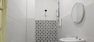 a white bathroom with a sink and a mirror at IFS Seri Iskandar by Glex in Seri Iskandar