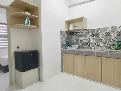 a kitchen with a sink and a counter top at IFS Seri Iskandar by Glex in Seri Iskandar