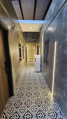 a hallway with a refrigerator and a tile floor at Jovial Industrial Stylish Lodge ````Bukit Mertajam in Bukit Mertajam