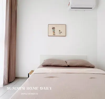 a bed in a white bedroom with a picture on the wall at Georgetown Childroom Seaview & Cityview Infinity Pool with 2 Carpark in Jelutong