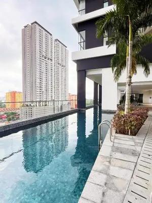 a swimming pool on the side of a building at Georgetown Childroom Seaview & Cityview Infinity Pool with 2 Carpark in Jelutong
