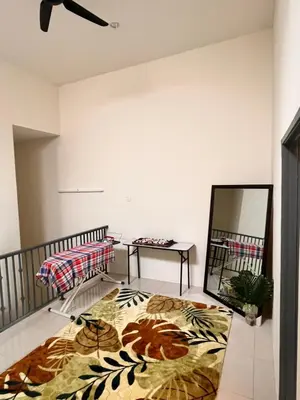 a room with a bed and a mirror in it at Homestay Ummi Seri Iskandar in Seri Iskandar