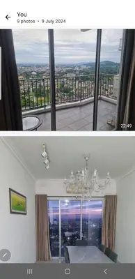 a room with a large window with a chandelier at Crystal Creek Taiping in Taiping