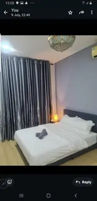 a picture of a bedroom with a white bed at Crystal Creek Taiping in Taiping