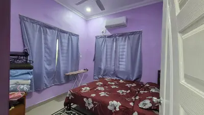 a bedroom with purple walls and a bed and a window at Sekinchan Homestay Teratak AZ - muslm only in Kampong Batu Dua Puloh Tiga