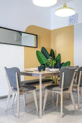 a dining room with a table and chairs at Cozy Premium Family Homestay in Cameron Highlands Brinchang Clover Home 4-06 in Brinchang