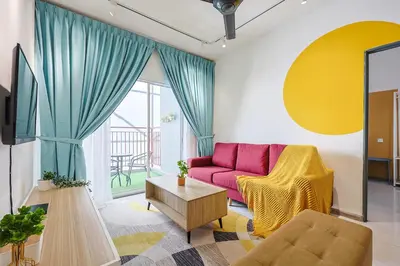 a living room with a pink couch and a table at Cozy Premium Family Homestay in Cameron Highlands Brinchang Clover Home 4-06 in Brinchang