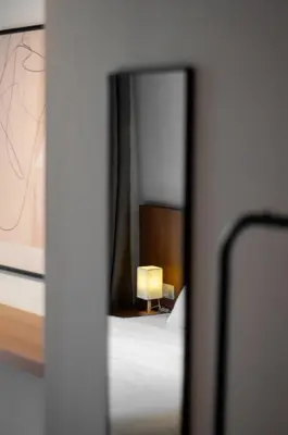 a view of a bedroom with a bed and a mirror at Heritage Villa by Aayu - 10 mins walk to Armenian St in George Town