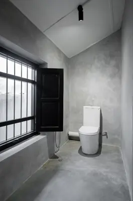 a bathroom with a toilet and a window at Heritage Villa by Aayu - 10 mins walk to Armenian St in George Town