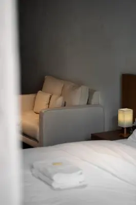 a living room with a couch and a bed at Heritage Villa by Aayu - 10 mins walk to Armenian St in George Town