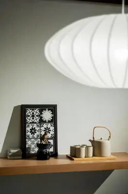 a shelf with a plate and a pot and a light at Heritage Villa by Aayu - 10 mins walk to Armenian St in George Town