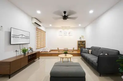 a living room with a couch and a table at Ipoh South Homestay 8-16pax 10mins to attraction in Ipoh