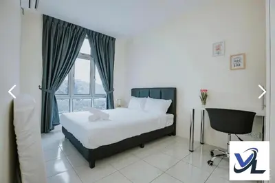 a bedroom with a bed and a window and a chair at Close Dun Book in Ipoh