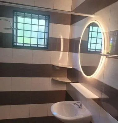 a bathroom with a sink and a mirror at Metime Ipoh Garden in Ipoh