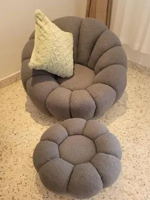 a circular chair with a pillow on the floor at Metime Ipoh Garden in Ipoh