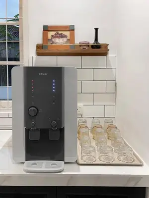 a coffee maker and glasses on a counter at The Petrichor in Tupai