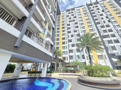 a swimming pool in the middle of a building with tall buildings at Majestic The Imperial Tower - Ipoh in Ipoh