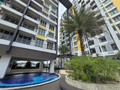 a building with a palm tree and a swimming pool at Majestic The Imperial Tower - Ipoh in Ipoh