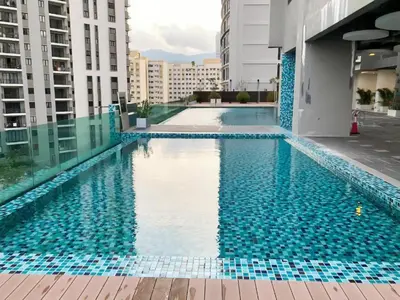 a swimming pool on the roof of a building at Jazz Service Suite in Bagan Jermal