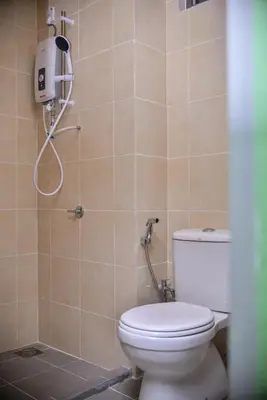 a bathroom with a toilet and a shower at Cameron Palas Homestay - Sunrise View in Brinchang