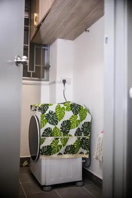 a bathroom with a toilet with a towel on it at Cameron Palas Homestay - Sunrise View in Brinchang