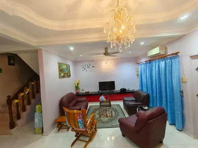 a living room with couches and a chandelier at GS Homestay Bercham Ipoh in Ipoh
