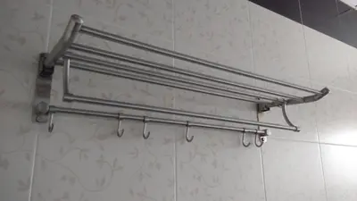 a towel rack on the wall of a bathroom at Bercham Vacation House in Ipoh