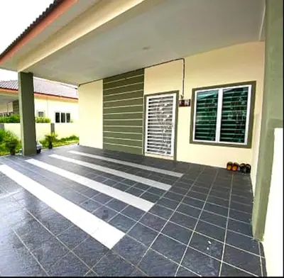 a house with a tile floor in front of it at CozyStayz Perak in Sitiawan