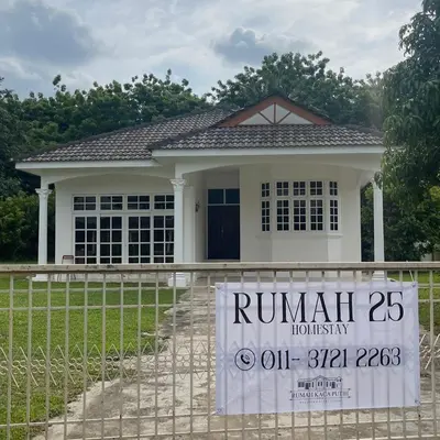 a house with a run rental sign in front of it at Homestay Rumah 25 in Sungai Petani