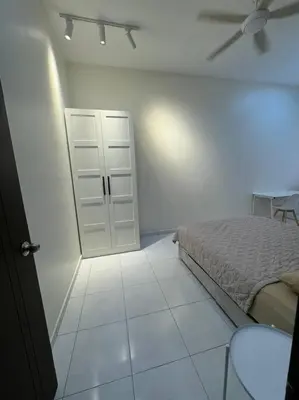 a bedroom with a bed and a ceiling fan at Minimalist Heaven Near Tmn Intan in Sungai Petani