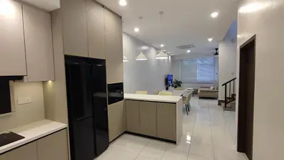 an open kitchen with a dining room and a living room at Minimalist Heaven Near Tmn Intan in Sungai Petani