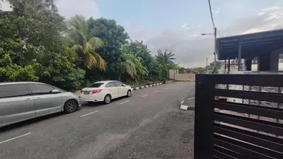 two cars parked on the side of a road at Minimalist Heaven Near Tmn Intan in Sungai Petani