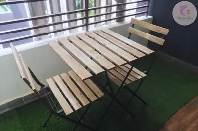 a wooden bench sitting on top of green grass at The Majestic Condo Ipoh Home Fairy 3 in Ipoh