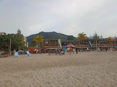 a group of people on a sandy beach at Sri sayang pearl view in Batu Ferringhi