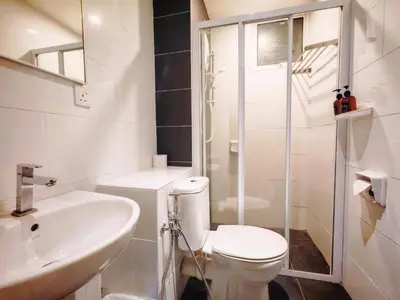 a bathroom with a toilet and a sink and a shower at Ipoh Majestic 2 Bedrooms 4Pax Modern Apartment by City Home Empire in Ipoh