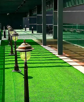a fire hydrant in the middle of a building with green grass at Ipoh Majestic 2 Bedrooms 4Pax Modern Apartment by City Home Empire in Ipoh