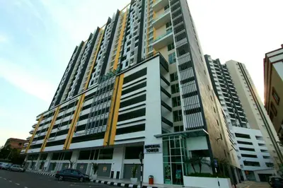 a large apartment building with a car parked in front of it at Ipoh Majestic 2 Bedrooms 4Pax Modern Apartment by City Home Empire in Ipoh