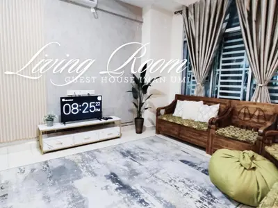 a living room with a couch and a tv at Guest House Iman Umi Bagan Serai in Bagan Serai