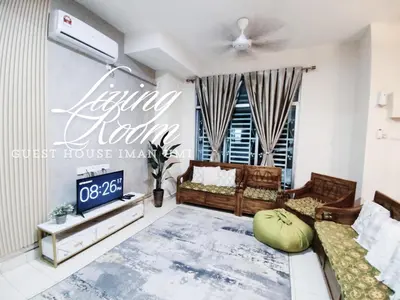 a living room with a couch and a tv at Guest House Iman Umi Bagan Serai in Bagan Serai