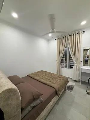 a bedroom with a large bed and a window at Idaman Cottage Sekinchan in Tanjung Karang