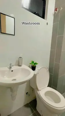 a bathroom with a toilet and a sink at Hidden Plan Homestay in Kepala Batas