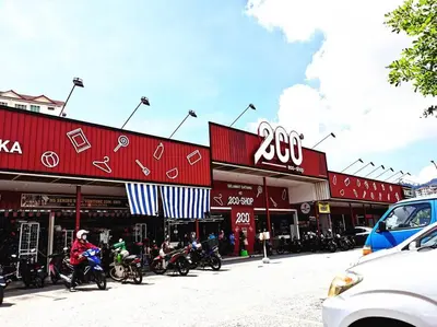 a group of motorcycles parked in front of buildings at Tur -Weeks Stay-3rooms Private House in Bayan Lepas